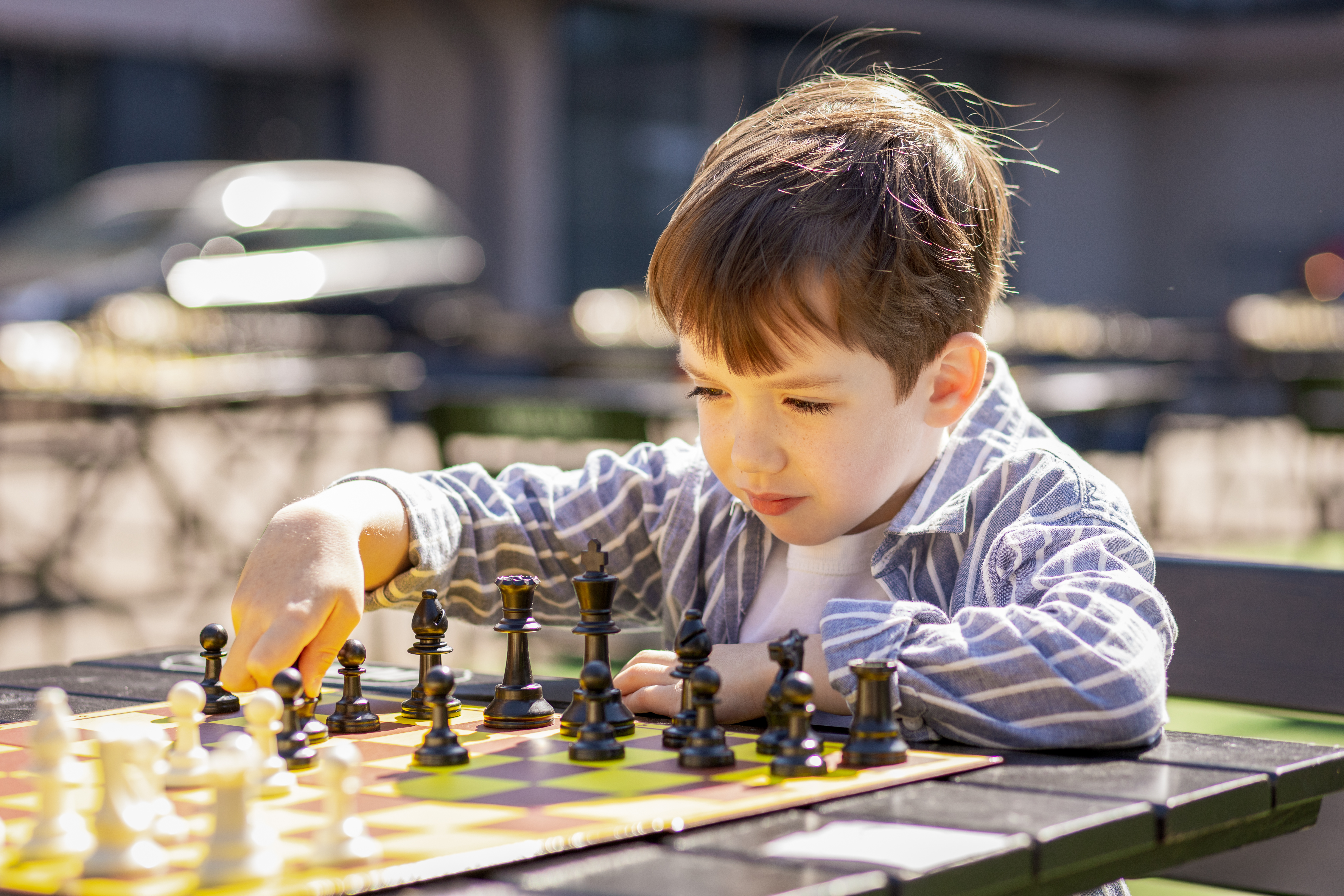 kid playing chess