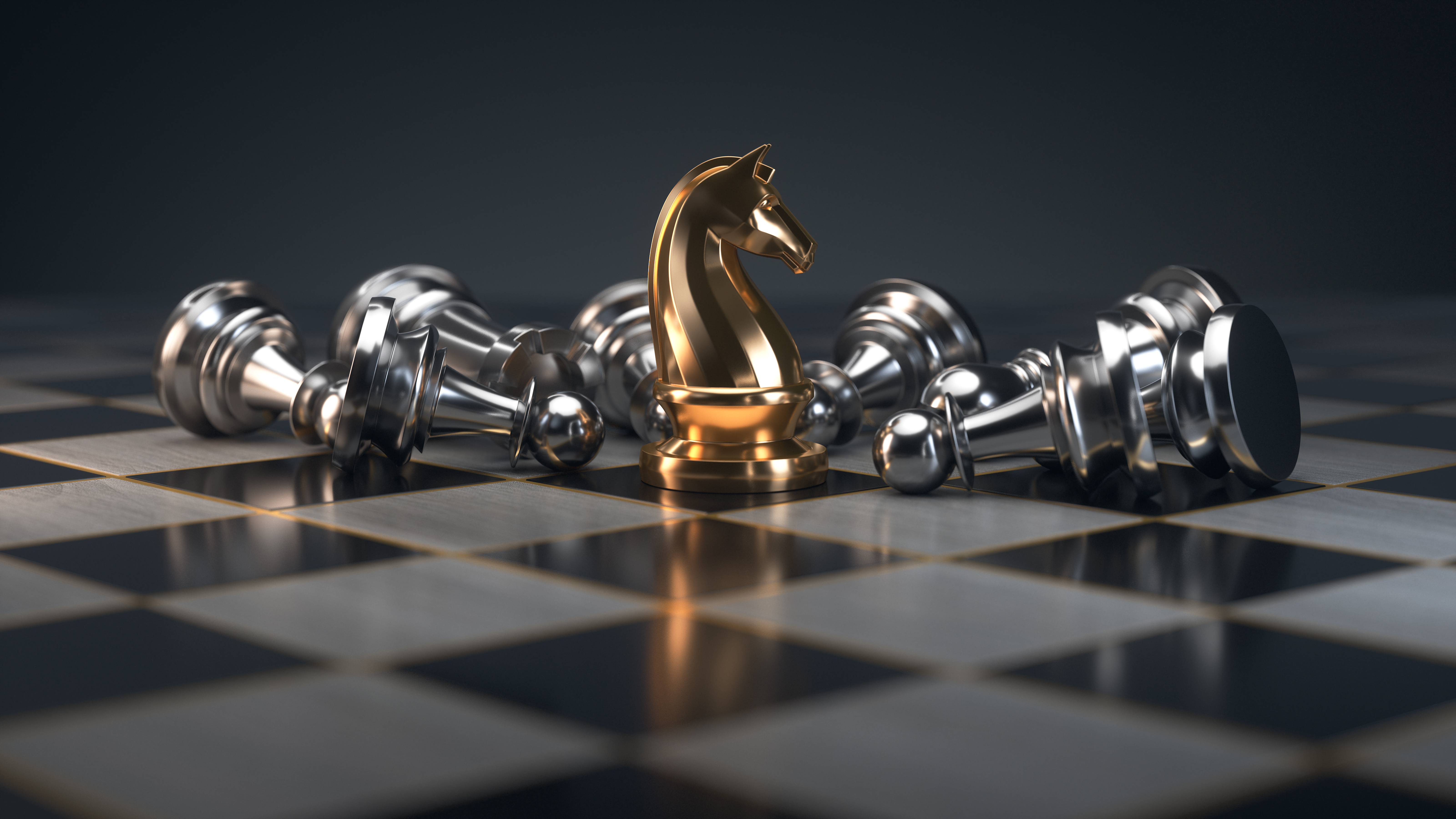 silver and gold metal chess pieces
