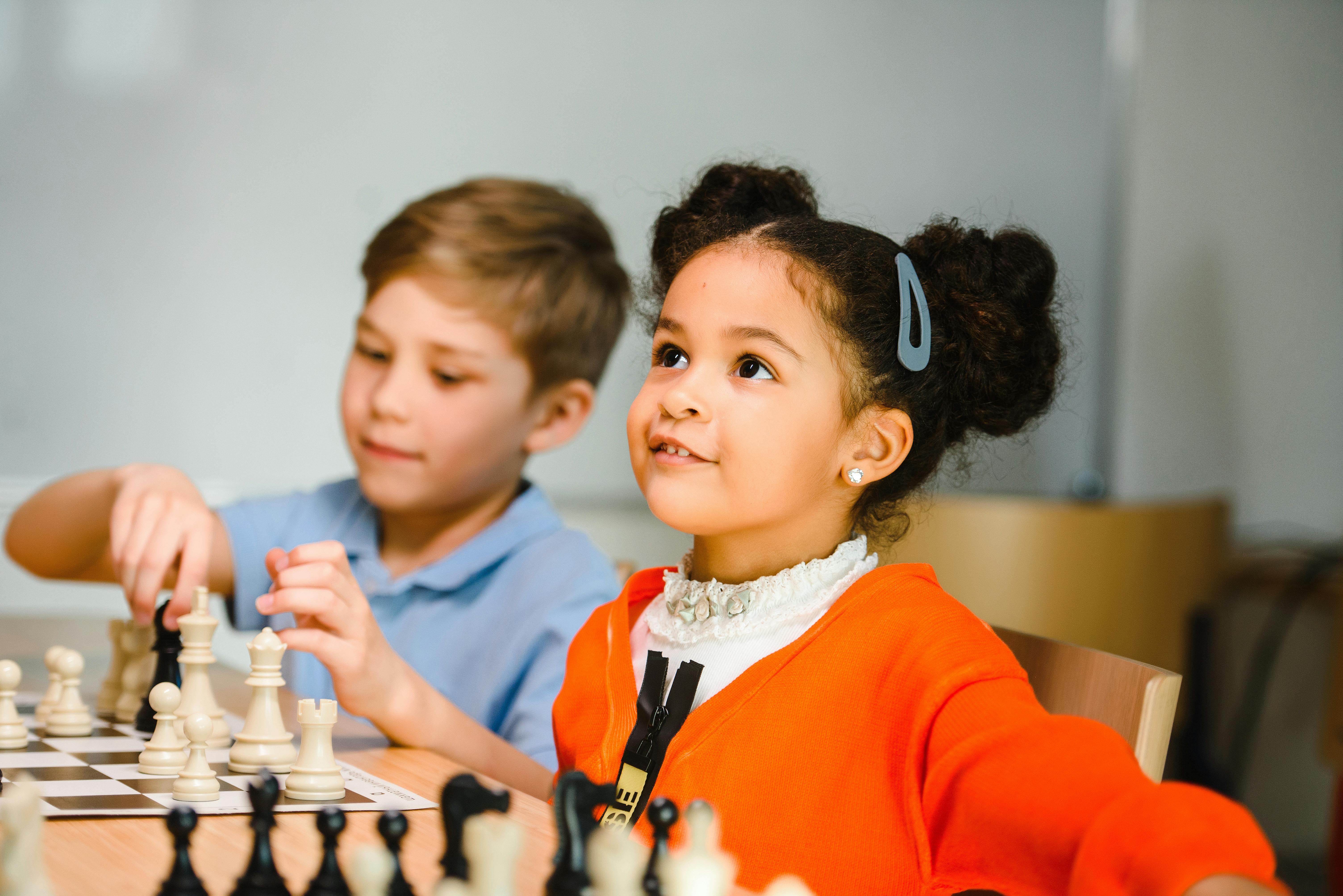 kids excited while playing chess