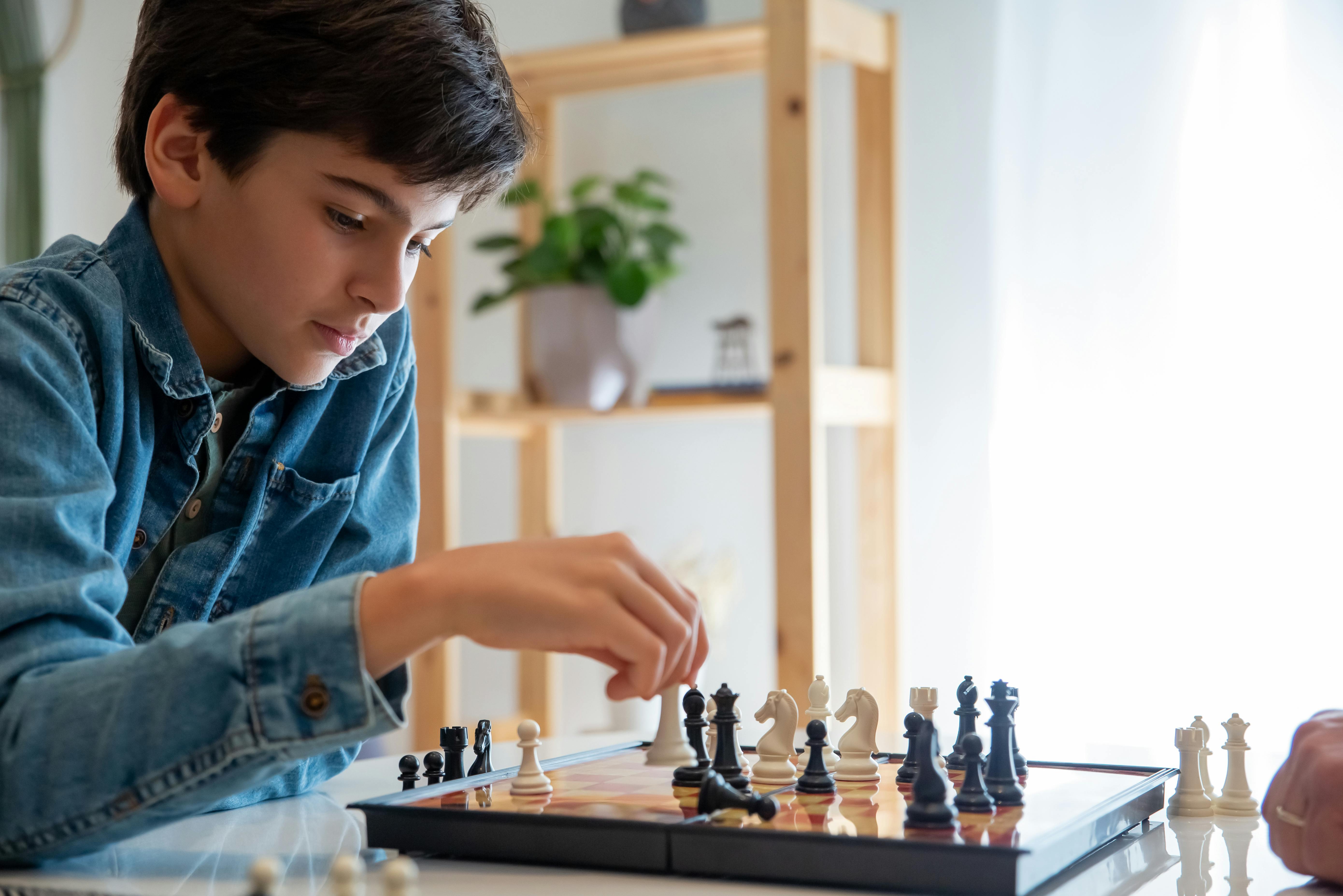 kid playing chess