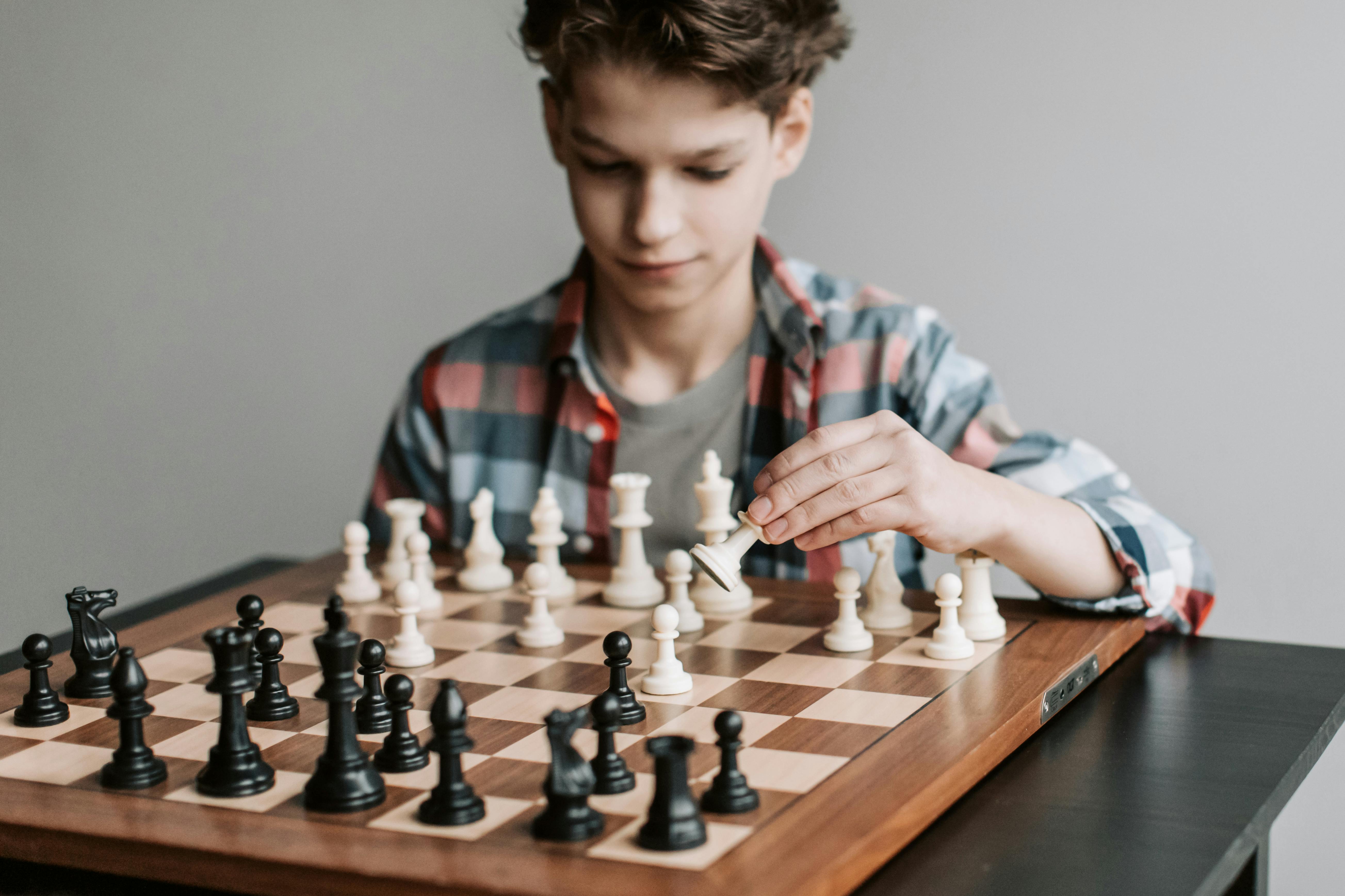 kid playing chess